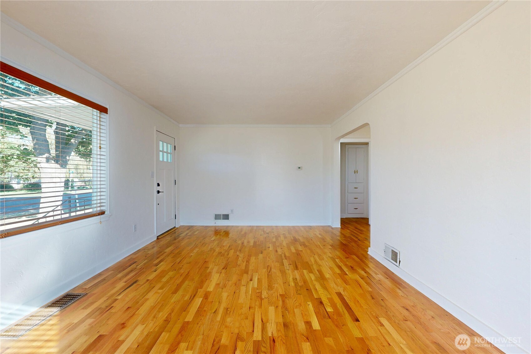 1303 Modoc Street Walla Walla, WA 99362 - Photo 2 of 40 a view of a room with wooden floor and brick walls