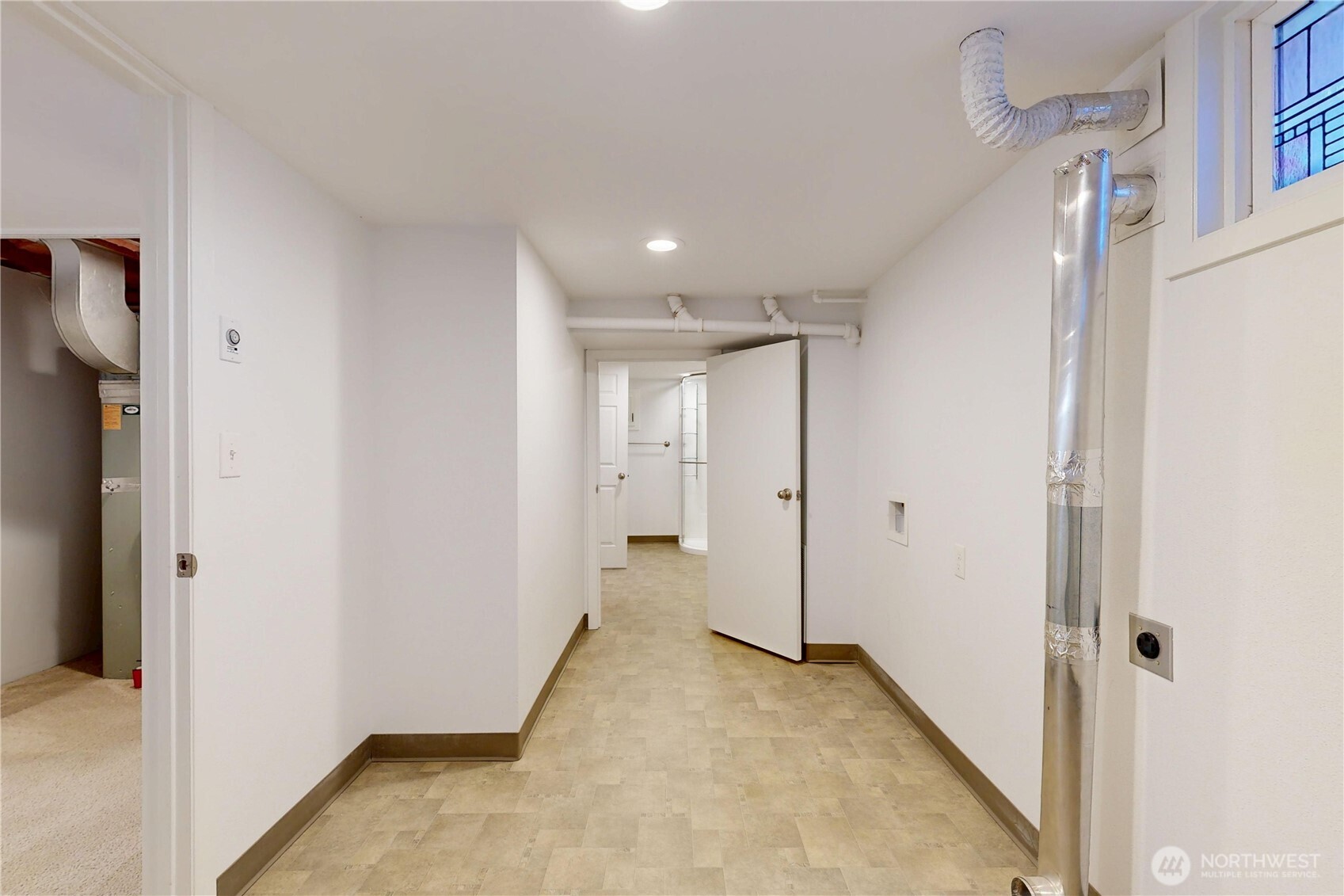 1303 Modoc Street Walla Walla, WA 99362 - Photo 28 of 40 a view of a hallway with wooden floor and closet