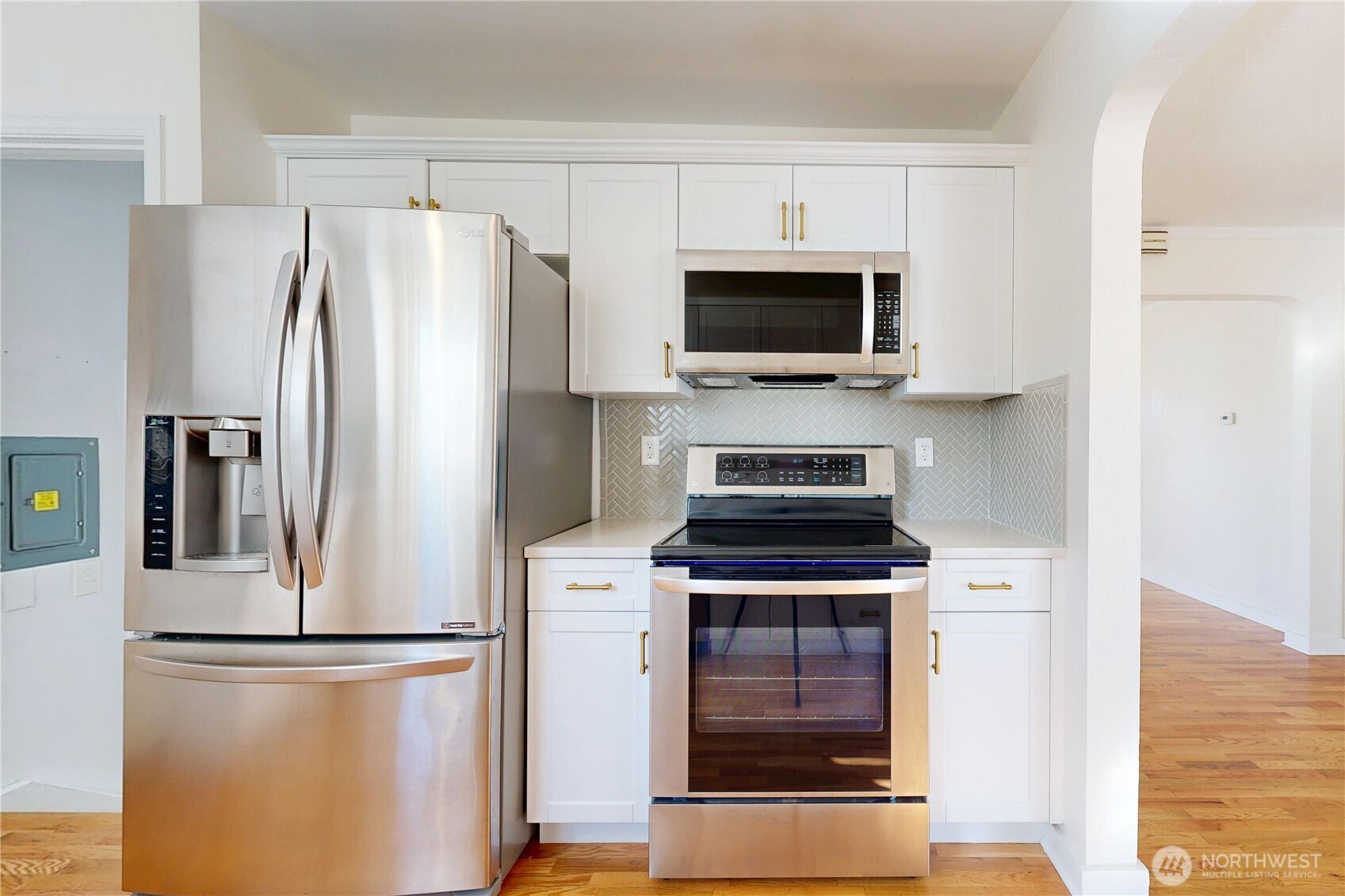 1303 Modoc Street Walla Walla, WA 99362 - Photo 5 of 40 a kitchen with a refrigerator stove and microwave