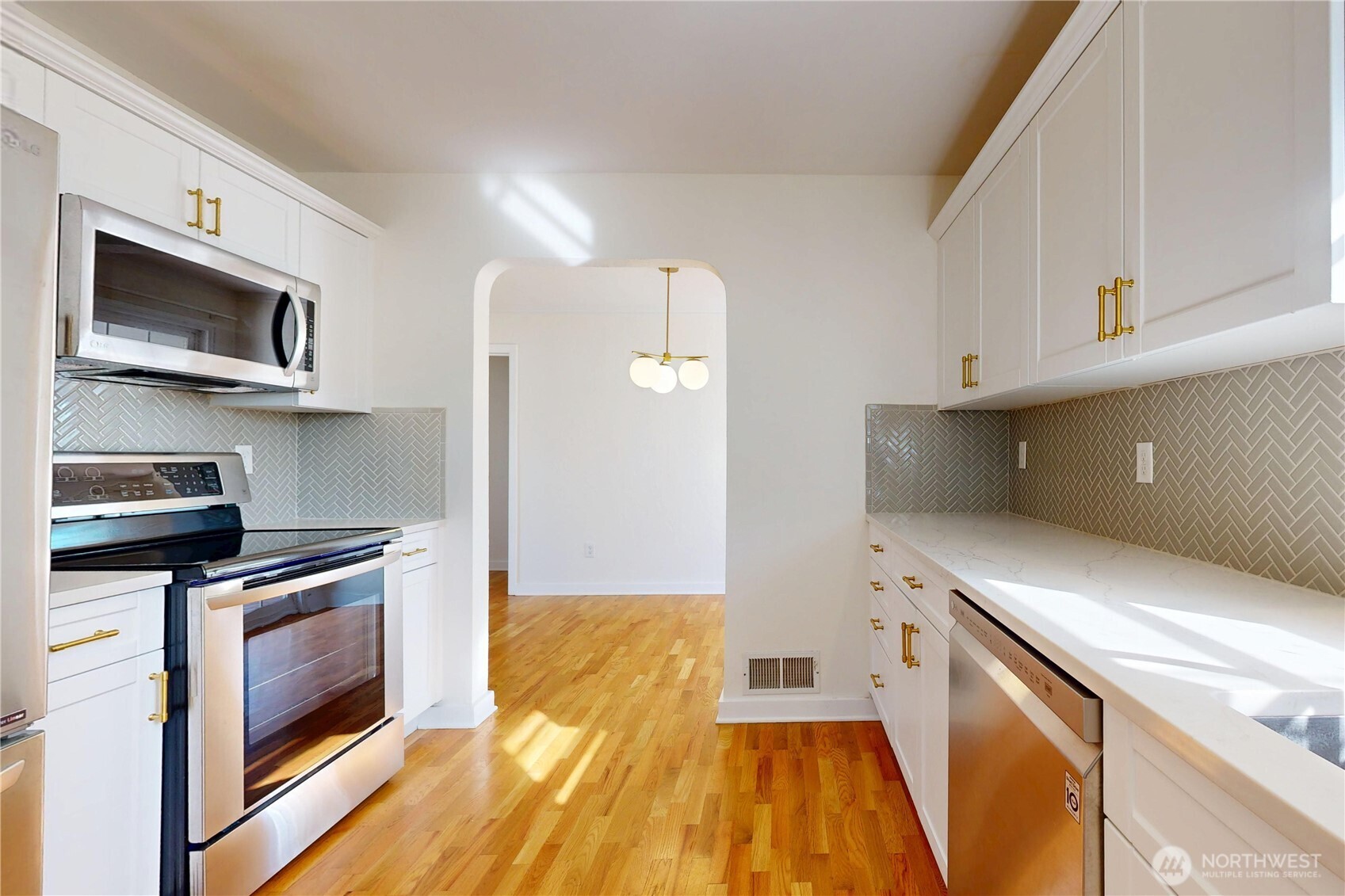 1303 Modoc Street Walla Walla, WA 99362 - Photo 6 of 40 a kitchen with stainless steel appliances a stove microwave and sink