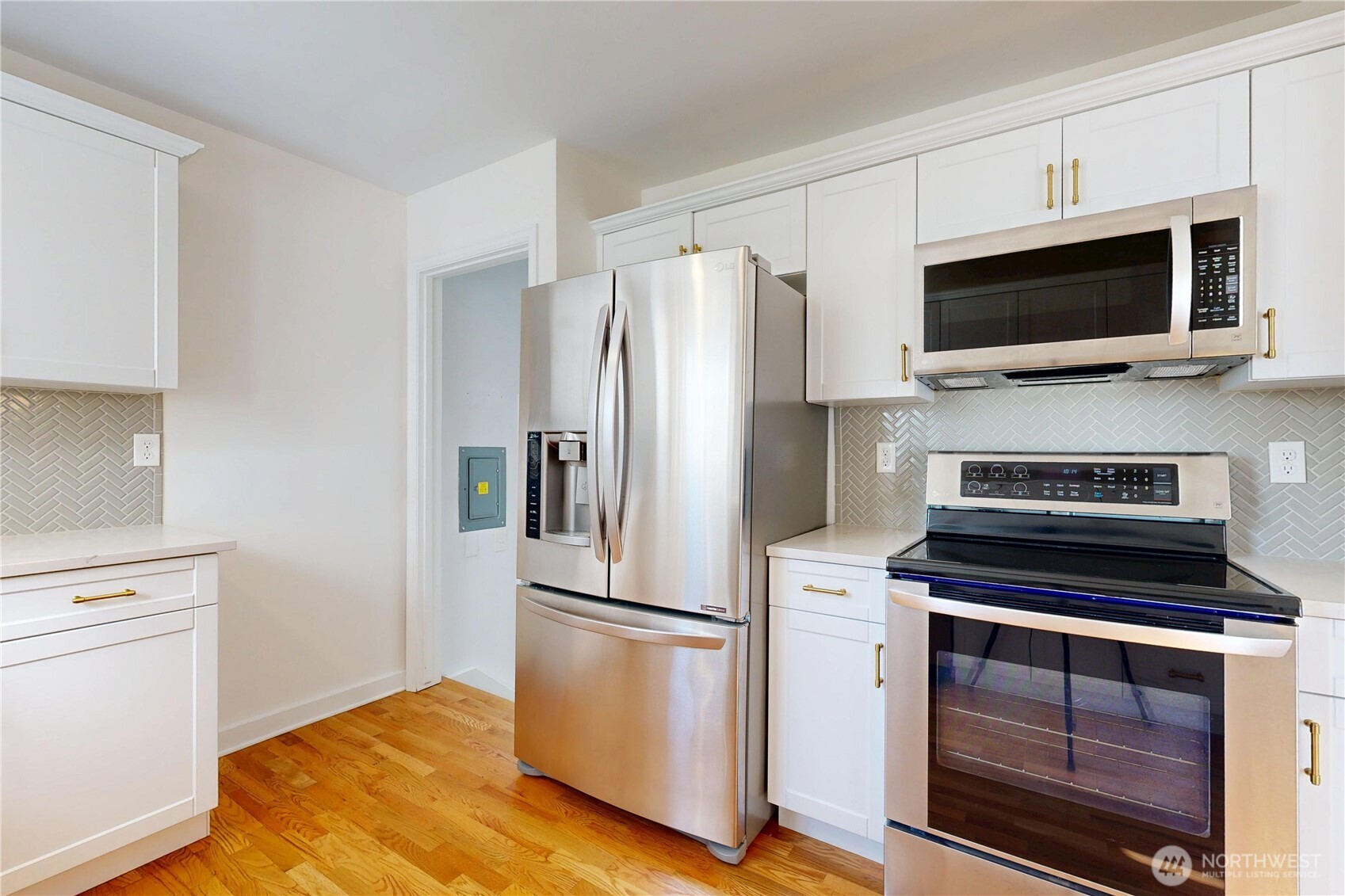 1303 Modoc Street Walla Walla, WA 99362 - Photo 7 of 40 a kitchen with a refrigerator stove and microwave