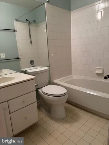 a bathroom with a toilet a sink and a bathtub
