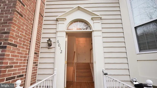 a view of a wooden door of the house