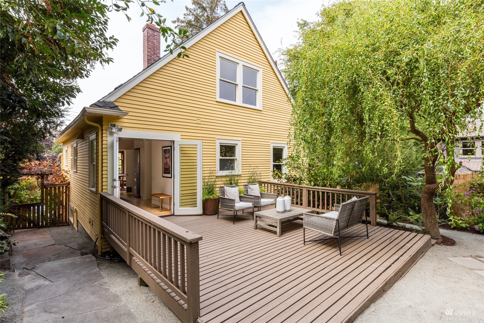 1724 31st Avenue Seattle, WA 98122 - Photo 17 of 34 a view of a house with wooden deck and furniture