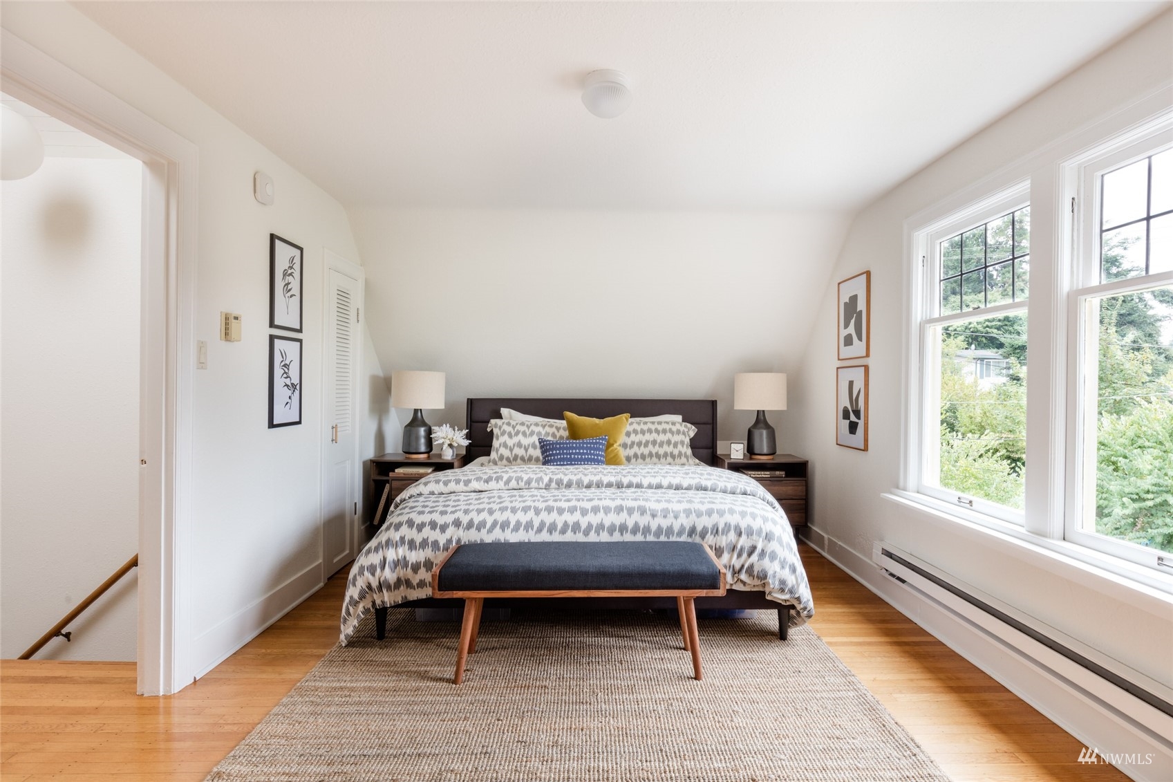 1724 31st Avenue Seattle, WA 98122 - Photo 23 of 34 a bedroom with a bed lamp and a window