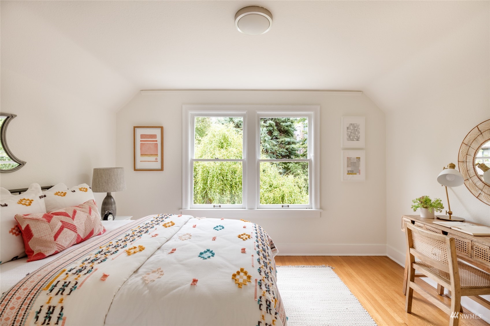 1724 31st Avenue Seattle, WA 98122 - Photo 26 of 34 a bedroom with a bed and a window