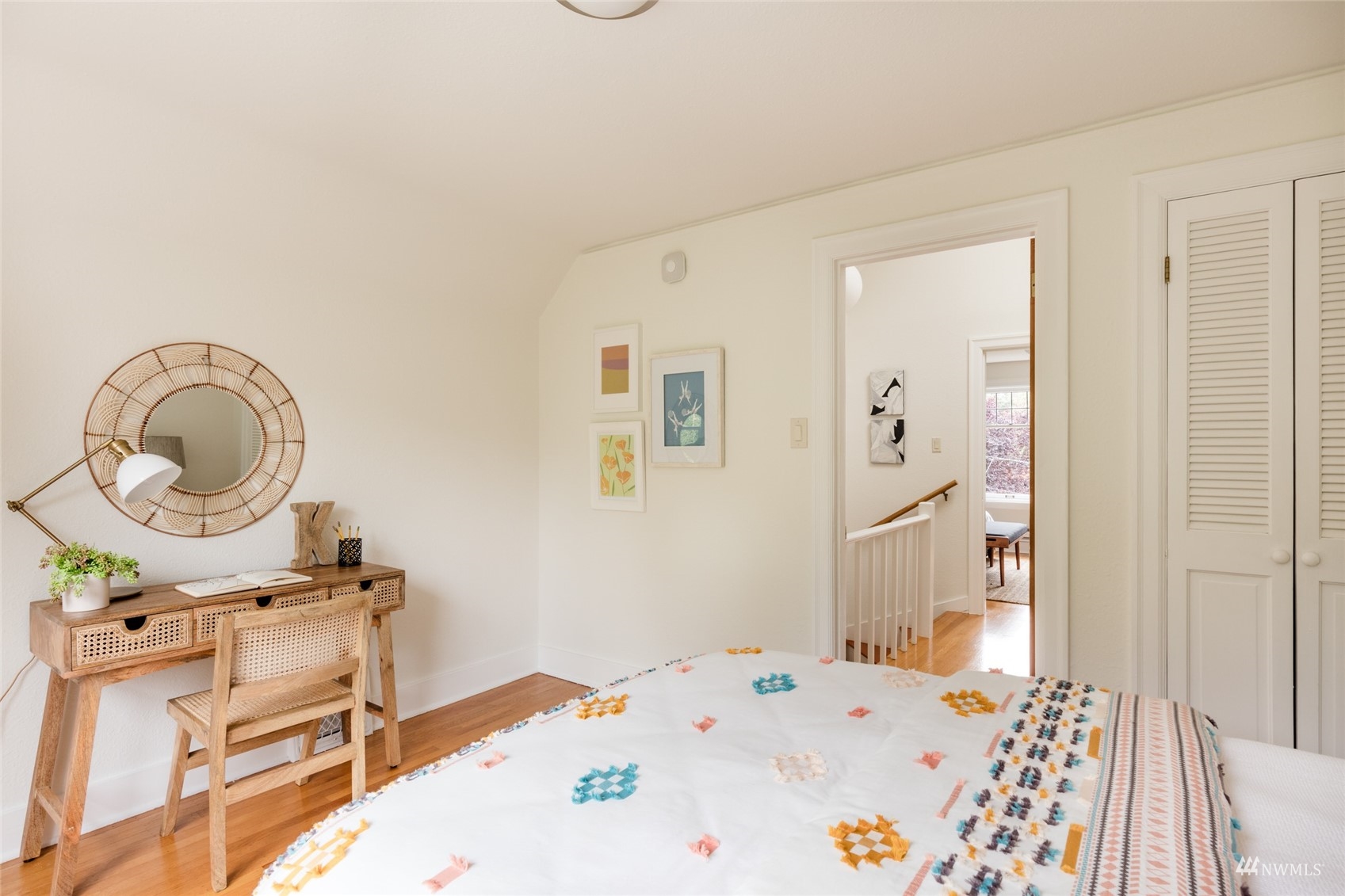 1724 31st Avenue Seattle, WA 98122 - Photo 28 of 34 a bedroom with a bed a stove and a a mirror