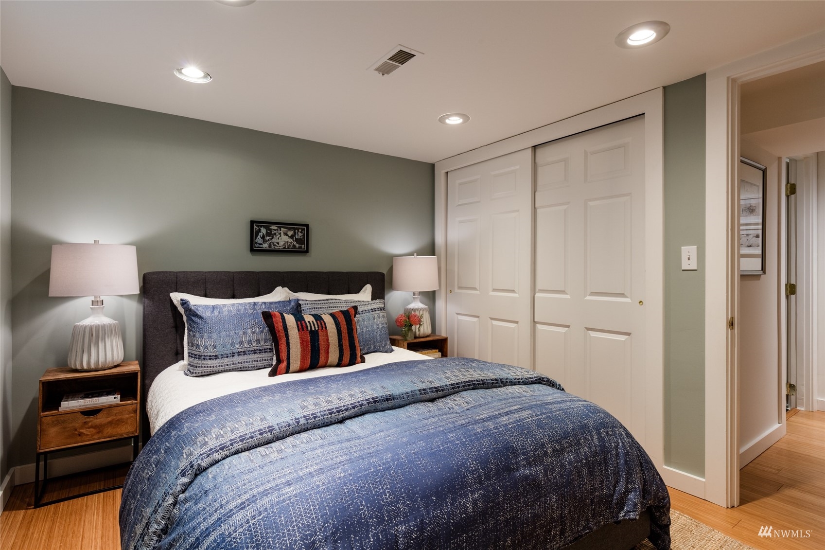 1724 31st Avenue Seattle, WA 98122 - Photo 31 of 34 a bedroom with a bed and a lamp