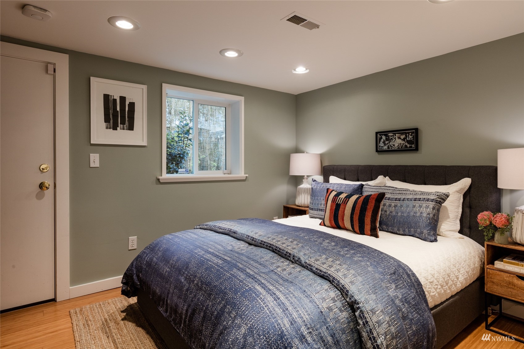 1724 31st Avenue Seattle, WA 98122 - Photo 32 of 34 a bed room with a bed and a night stand