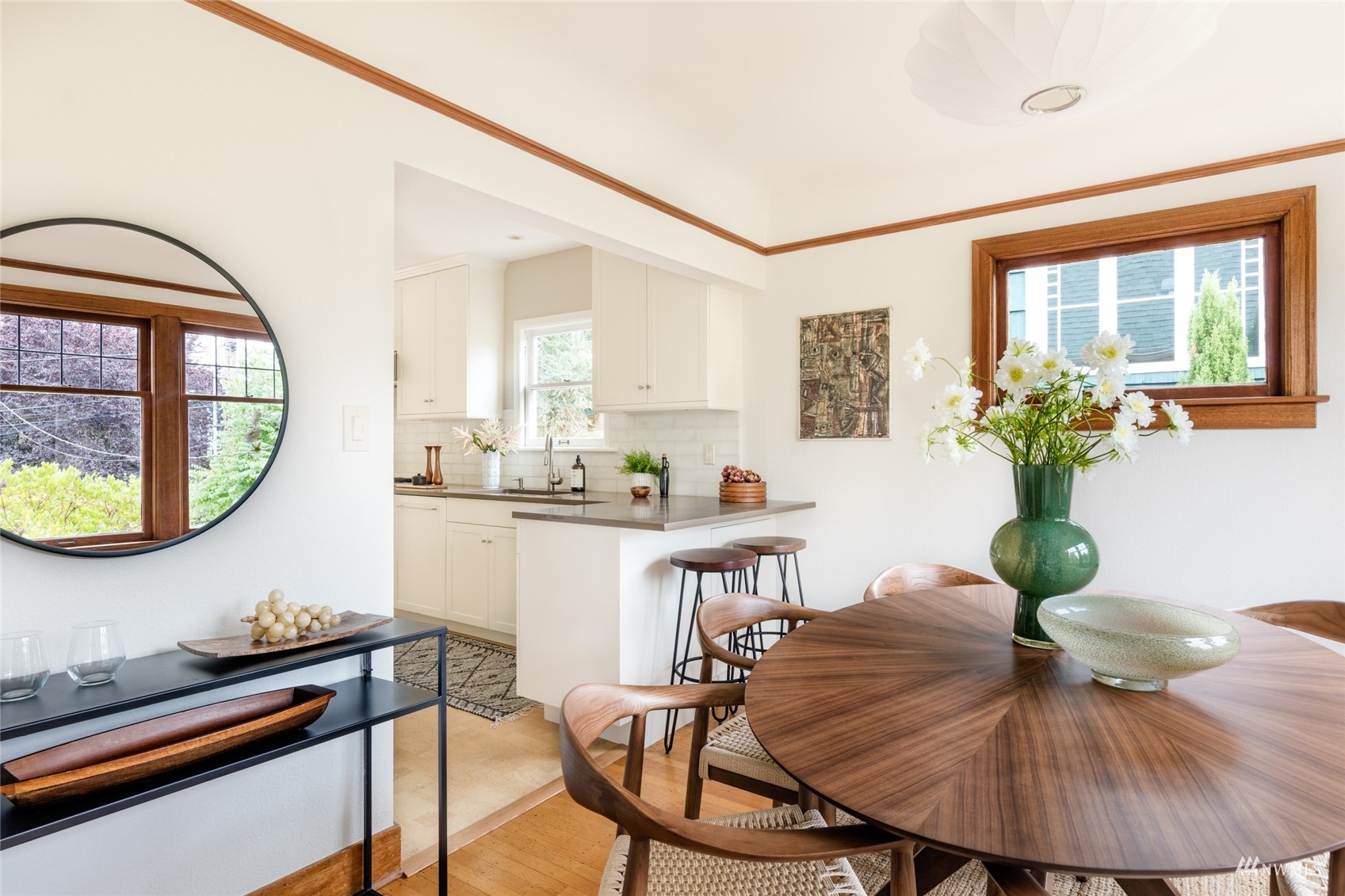 1724 31st Avenue Seattle, WA 98122 - Photo 7 of 34 a view of a dining room with furniture and a potted plant