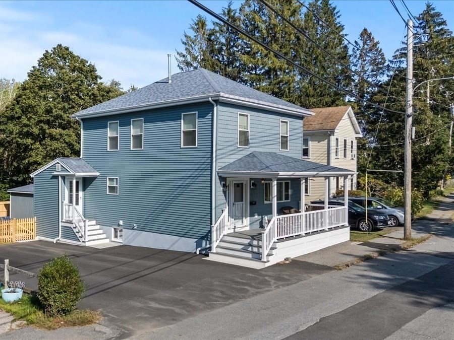 17 Old Essex Road Manchester, MA 01944 - Photo 1 of 40 a front view of a house with a garden and plants