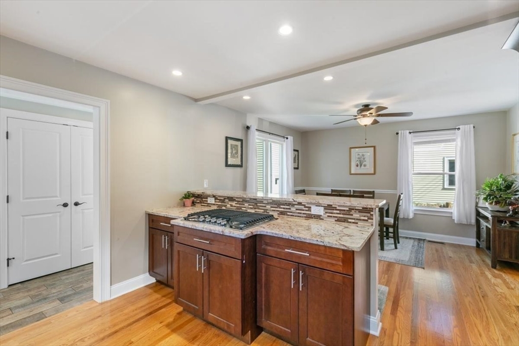 17 Old Essex Road Manchester, MA 01944 - Photo 12 of 40 a kitchen that has a stove and a table