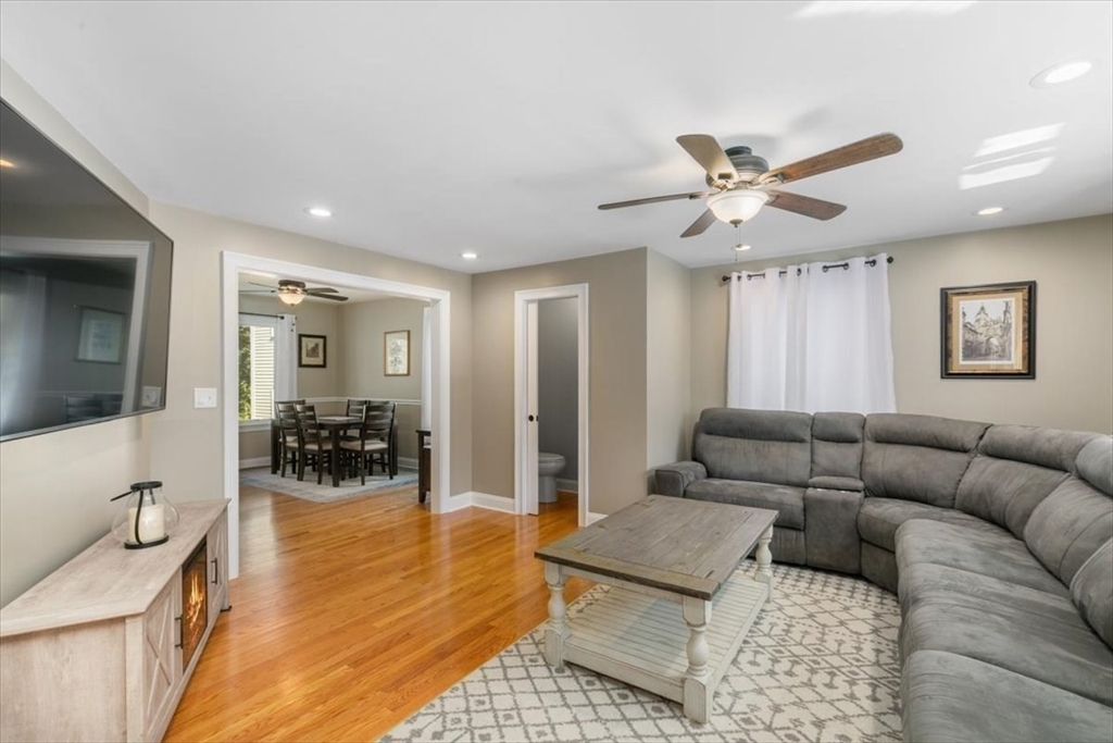 17 Old Essex Road Manchester, MA 01944 - Photo 18 of 40 a living room with furniture and a table with wooden floor