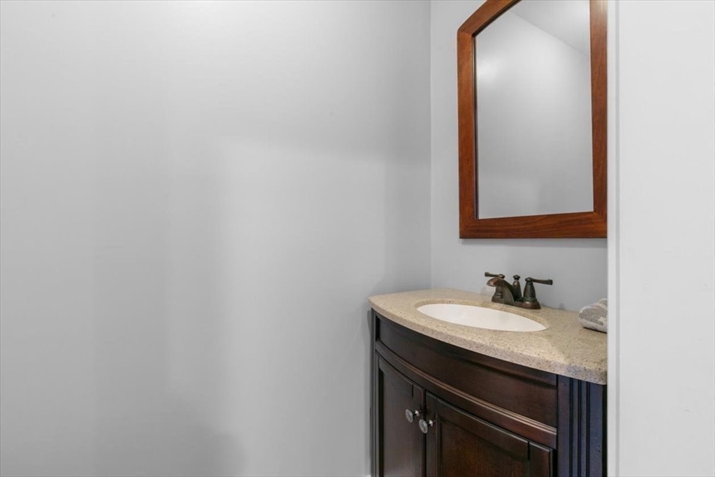 17 Old Essex Road Manchester, MA 01944 - Photo 20 of 40 a bathroom with a sink and a mirror