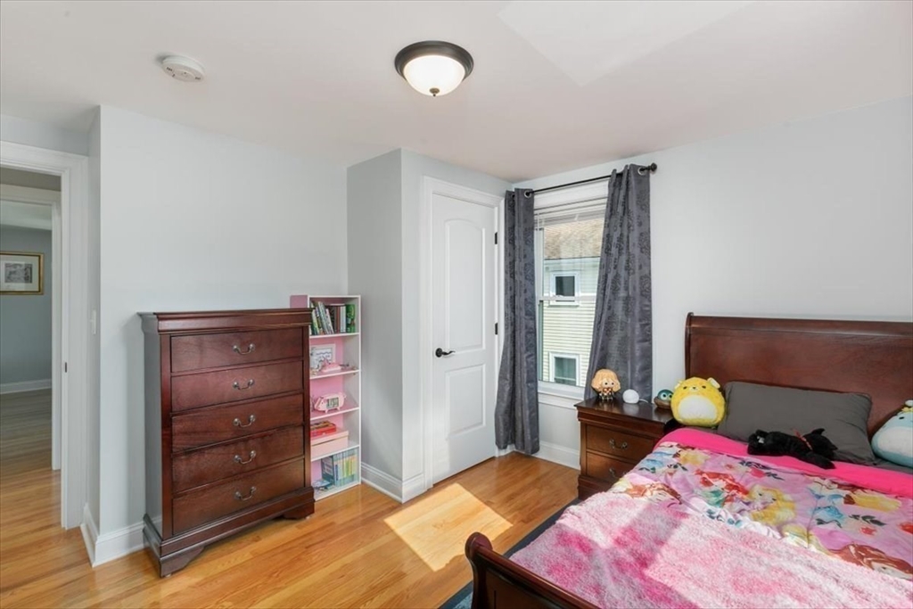 17 Old Essex Road Manchester, MA 01944 - Photo 26 of 40 a bedroom with a bed and furniture