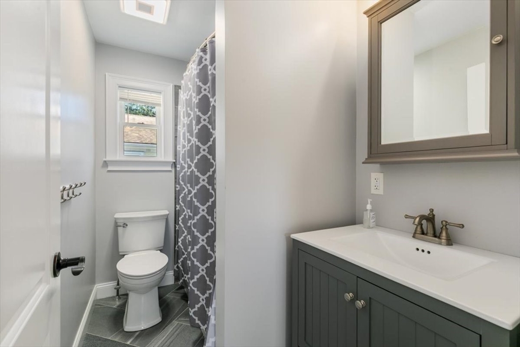 17 Old Essex Road Manchester, MA 01944 - Photo 27 of 40 a bathroom with a toilet a sink and mirror