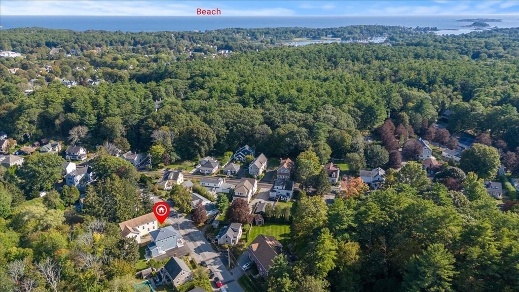 17 Old Essex Road Manchester, MA 01944 - Photo 3 of 40 an aerial view of a houses with a lush green hillside