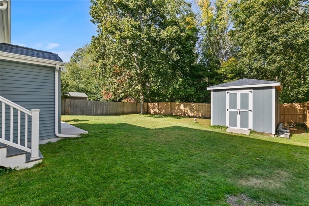 17 Old Essex Road Manchester, MA 01944 - Photo 35 of 40 a view of a house with backyard and a tree