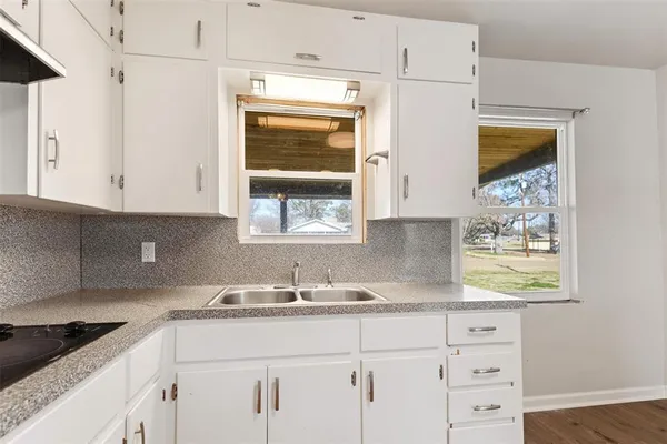 a view of a kitchen with wooden floor