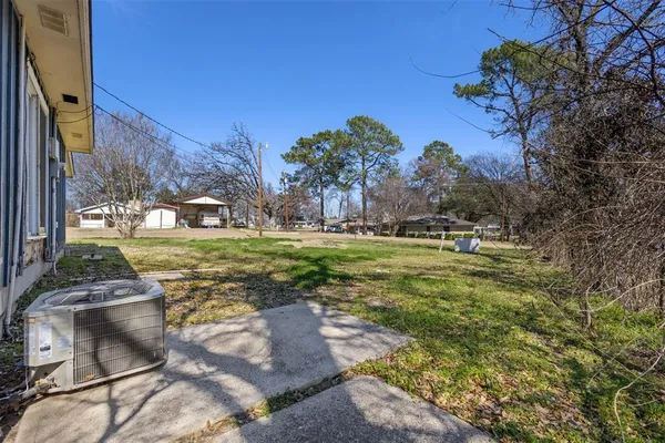 a house view with swimming pool in front of house