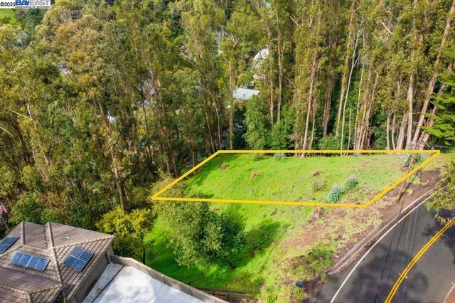 a view of a backyard with swimming pool
