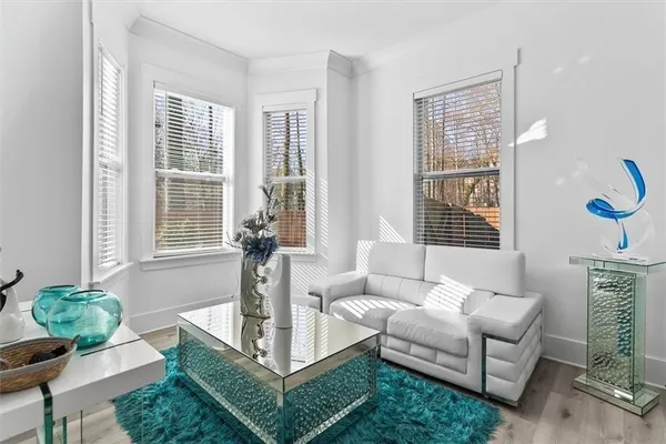a living room with furniture and a large window