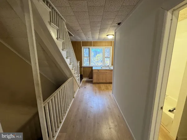 a view of entryway with wooden floor