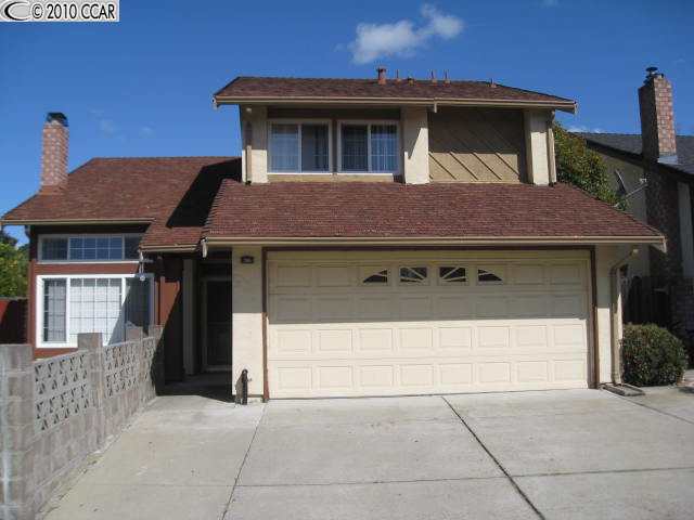703 Seacliff Court Rodeo, CA 94572 - Photo 1 of 1 a front view of a house with a garage