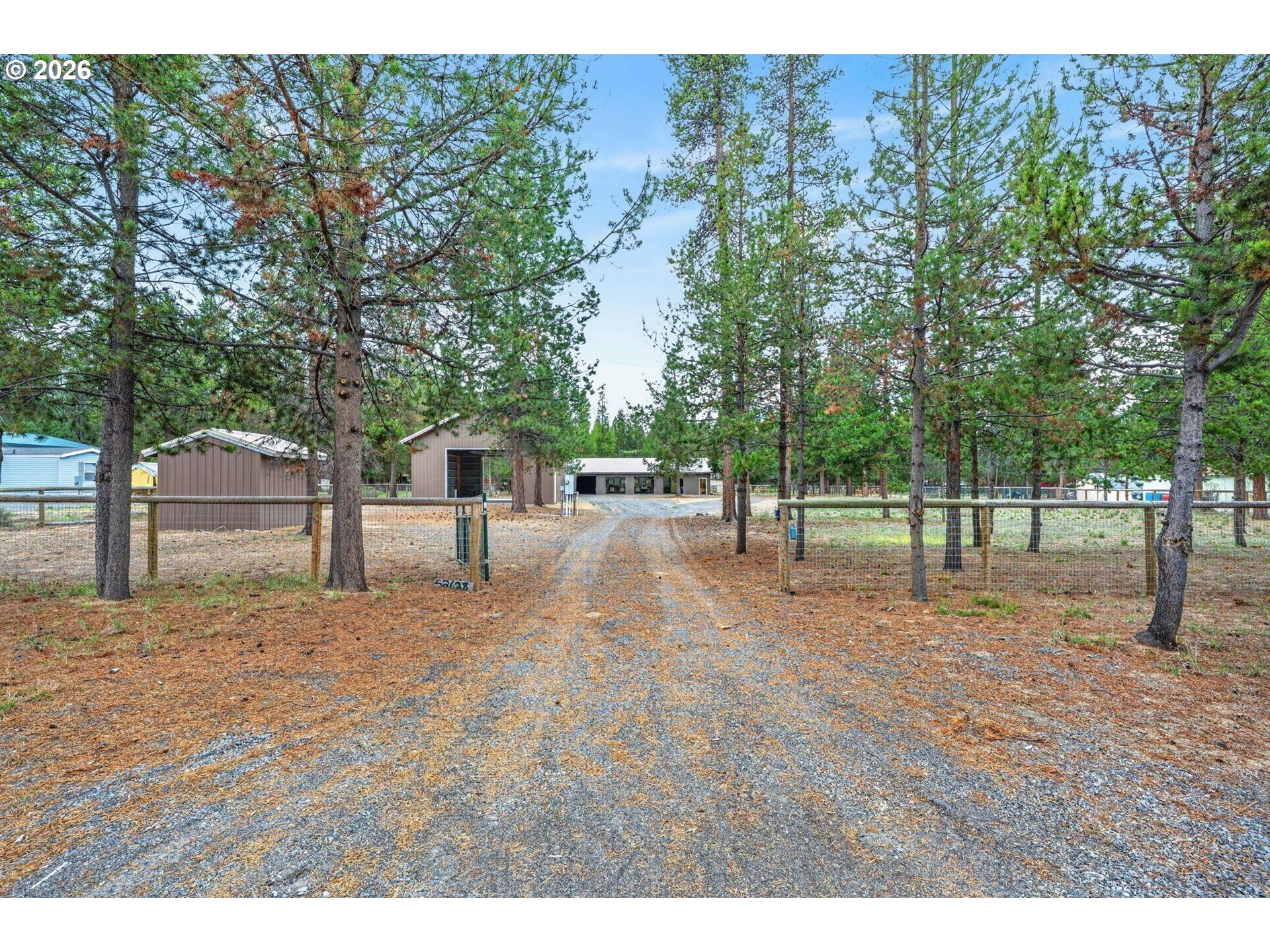 52628 Ammon Road, Unit 3 La Pine, OR 97739 - Photo 1 of 37 a view of a yard with basketball court