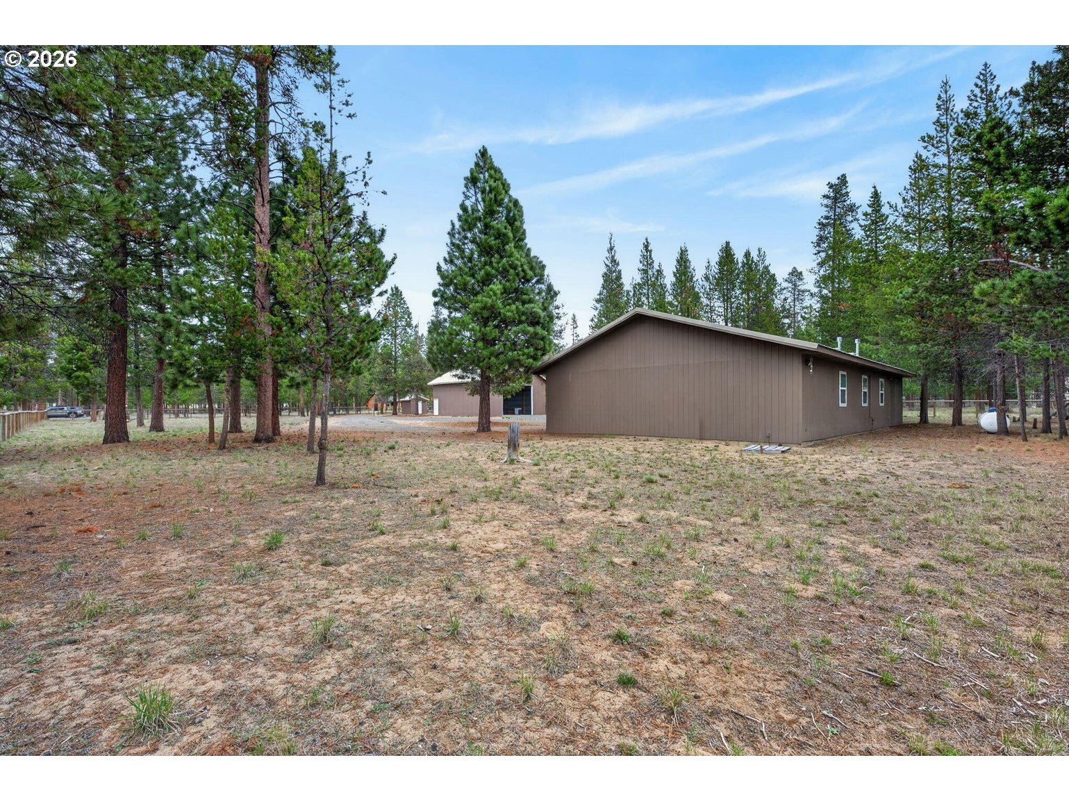 52628 Ammon Road, Unit 3 La Pine, OR 97739 - Photo 24 of 37 a backyard of a house with lots of green space