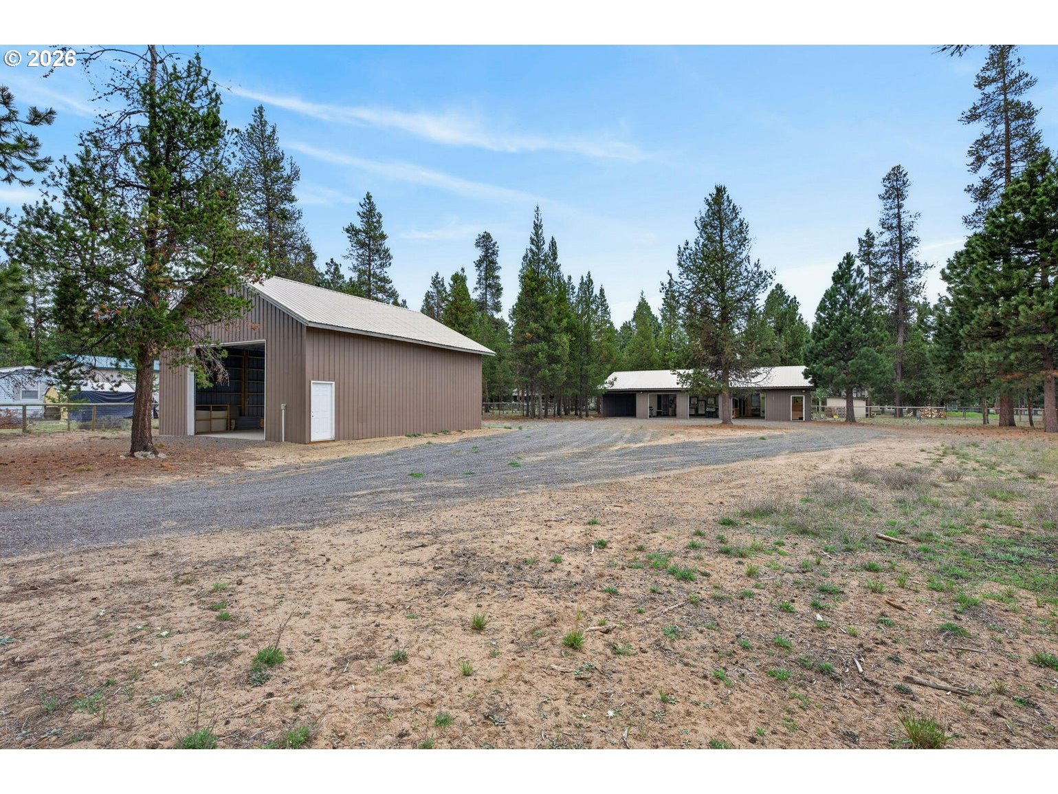 52628 Ammon Road, Unit 3 La Pine, OR 97739 - Photo 4 of 37 a backyard of a house with table and chairs