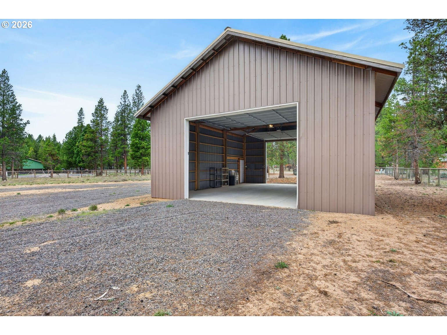 52628 Ammon Road, Unit 3 La Pine, OR 97739 - Photo 6 of 37 a view of wooden house with a yard and large tree