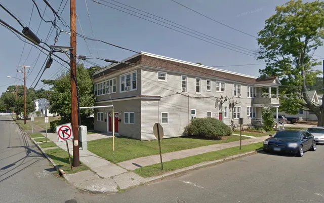 a street view with building and sign board