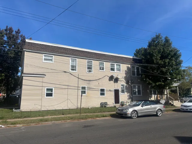 a car parked in front of a house