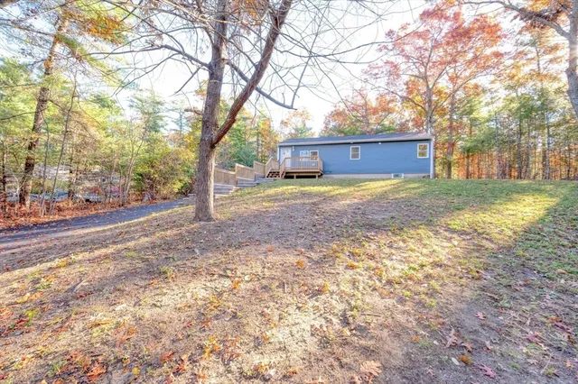 a view of backyard with large trees