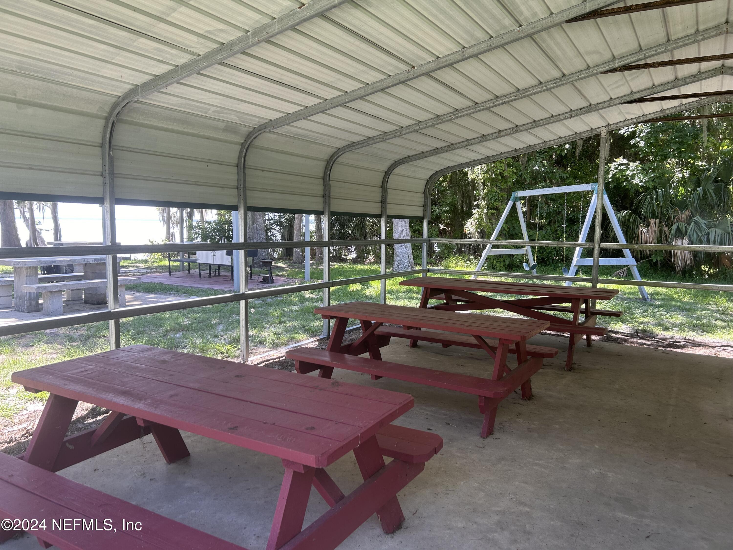 202 1st Street Georgetown, FL 32139 - Photo 11 of 13 a backyard view with a sitting space