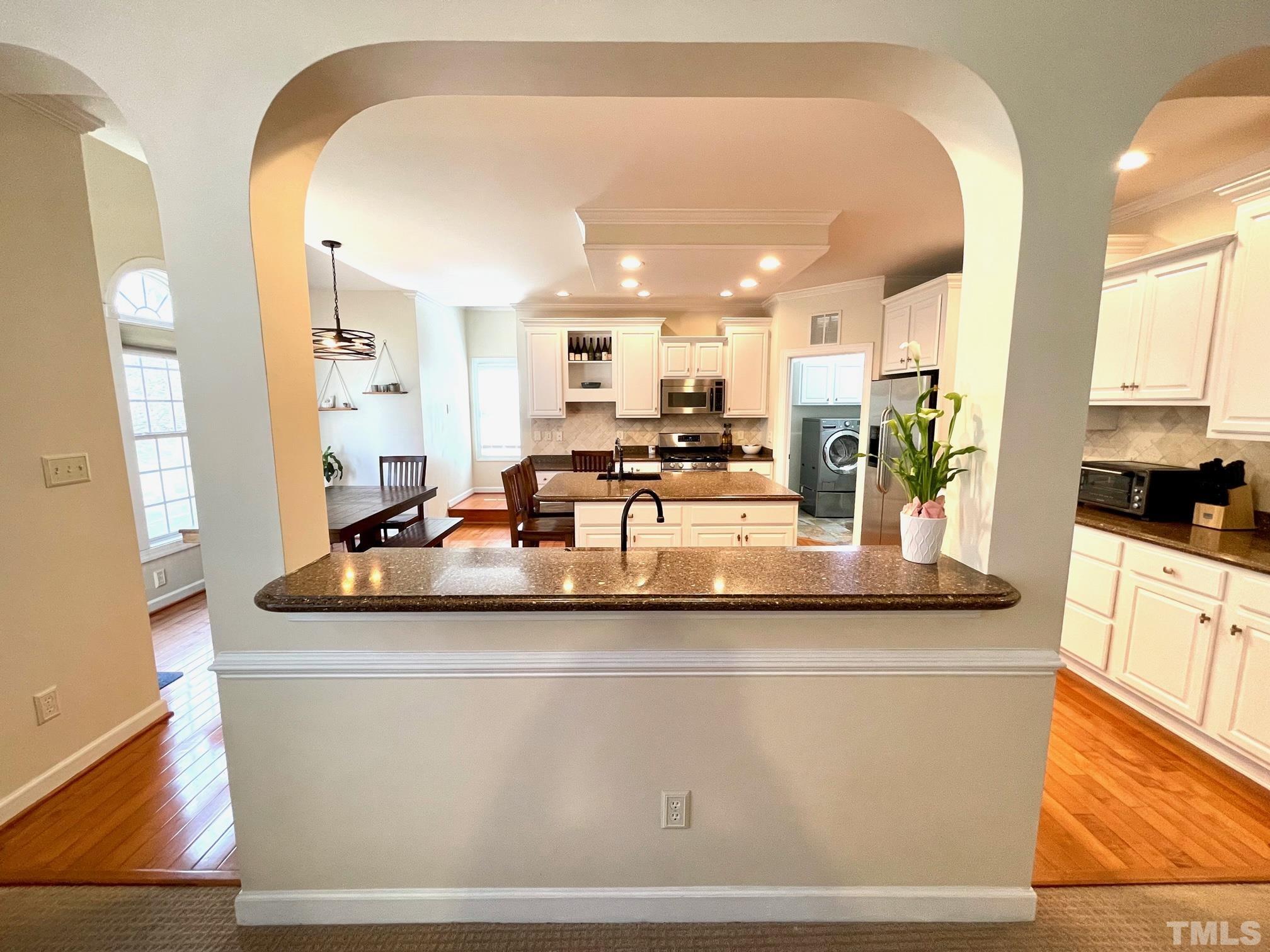 115 Beckford Road Cary, NC 27518 - Photo 17 of 50 a room with kitchen island granite countertop a large window
