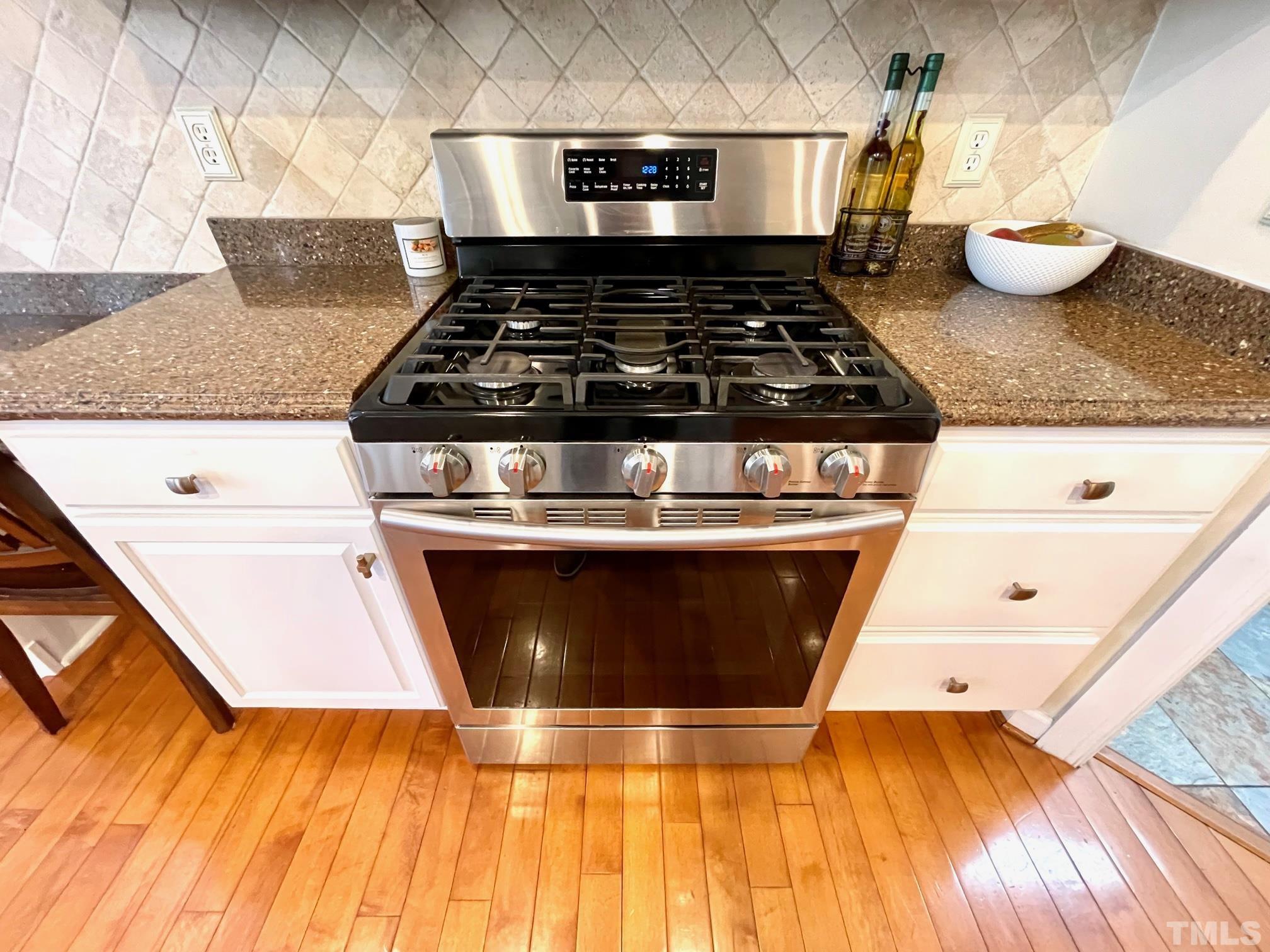 115 Beckford Road Cary, NC 27518 - Photo 47 of 50 a stove top oven sitting inside of a kitchen