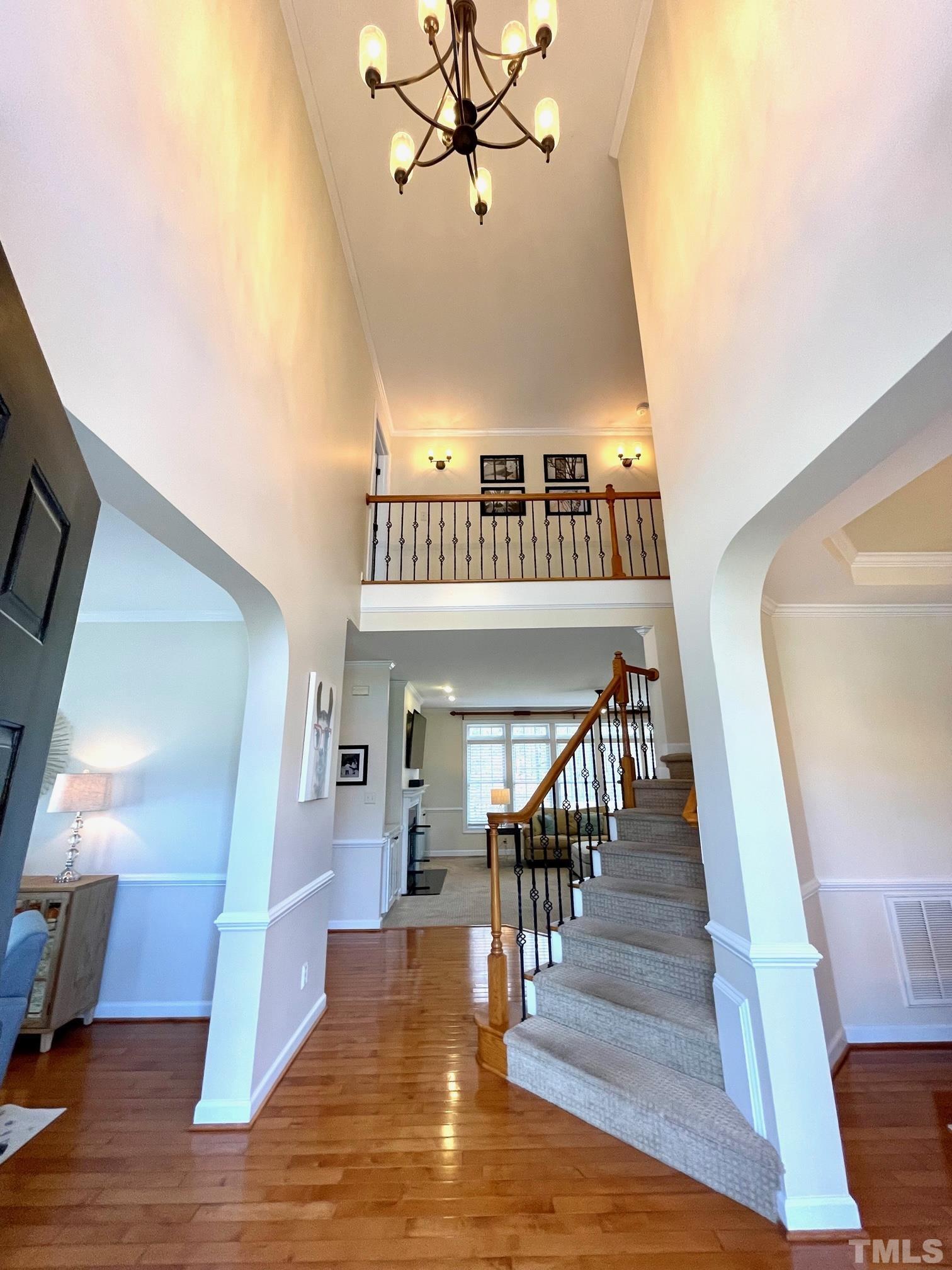 115 Beckford Road Cary, NC 27518 - Photo 7 of 50 a view of entryway and hall with wooden floor