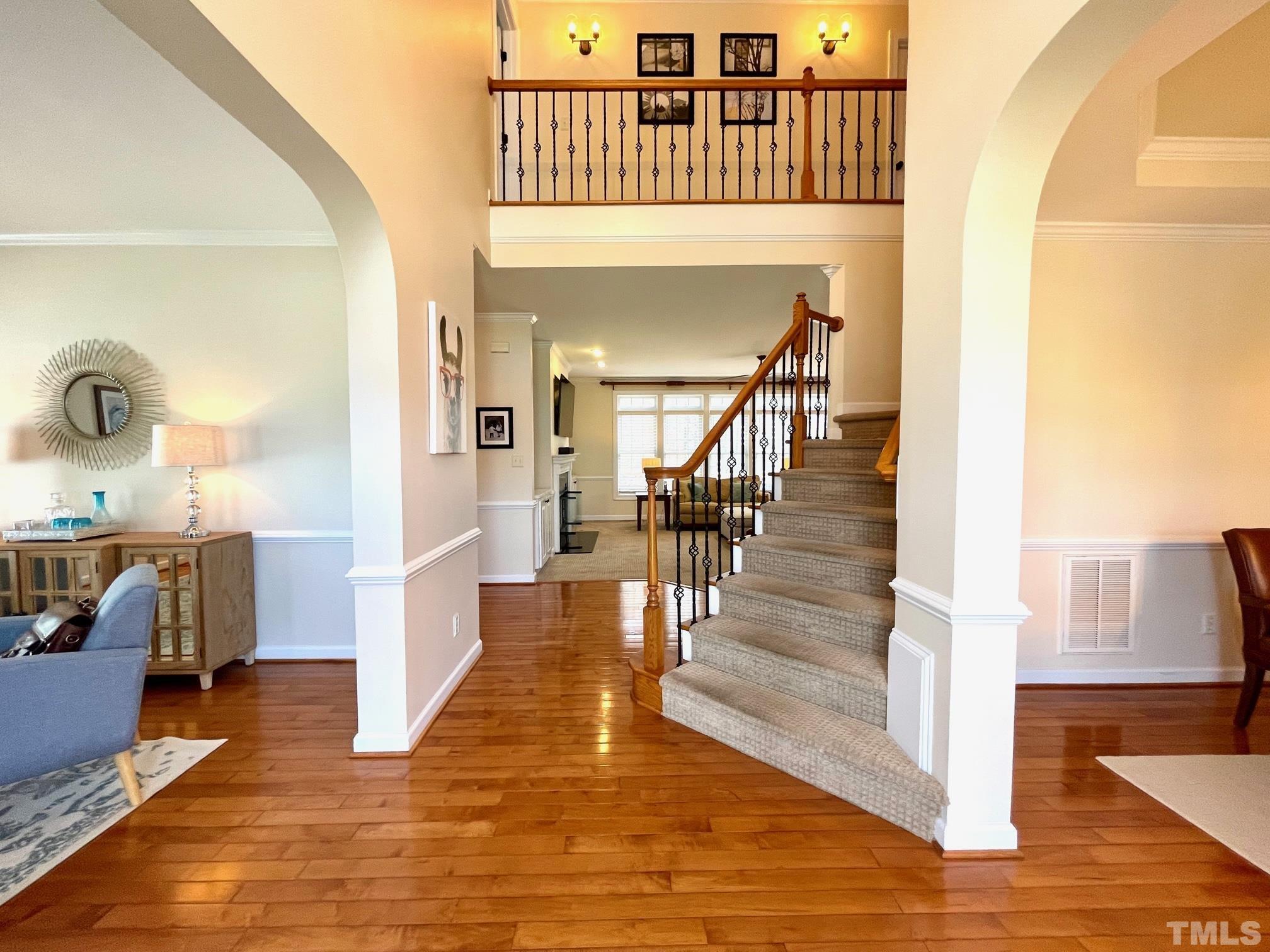 115 Beckford Road Cary, NC 27518 - Photo 8 of 50 a view of entryway and hall with wooden floor