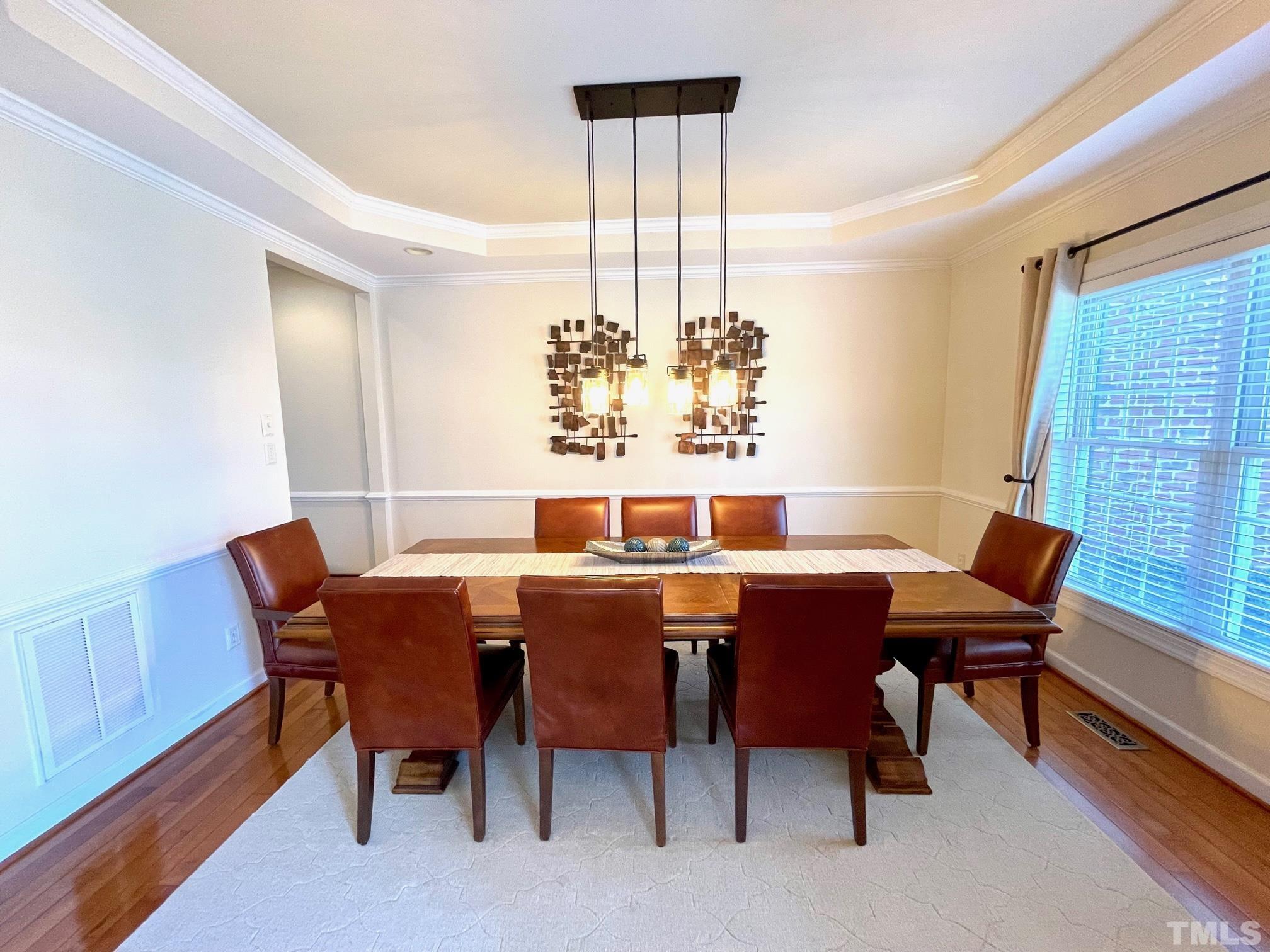 115 Beckford Road Cary, NC 27518 - Photo 9 of 50 a view of a dining room with furniture window and wooden floor