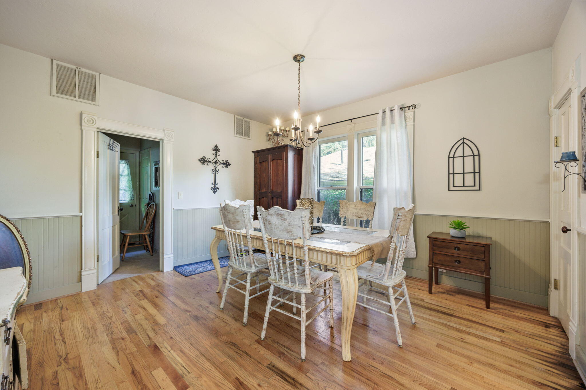 75 Wimer Street Ashland, OR 97520 - Photo 12 of 44 a view of a dining room with furniture window and wooden floor