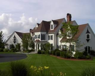 Undisclosed Address West Barnstable, MA 02668 - Photo 4 of 9 a front view of a house with a yard