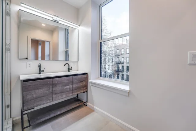 a bathroom with a bathtub and a sink