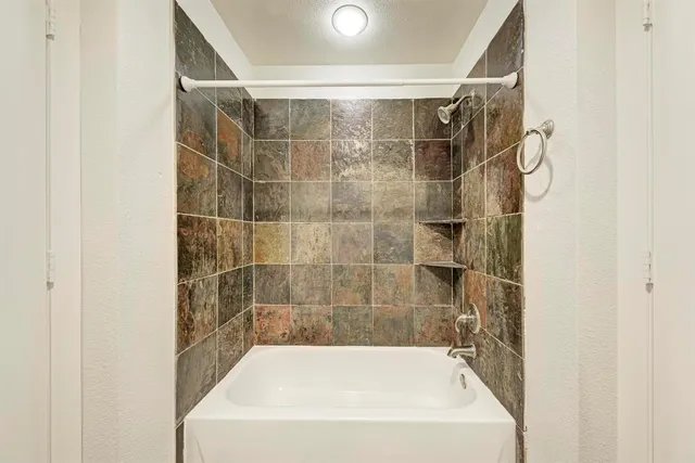 a bathroom with a bath tub
