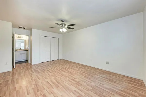 a view of an empty room with a bathroom