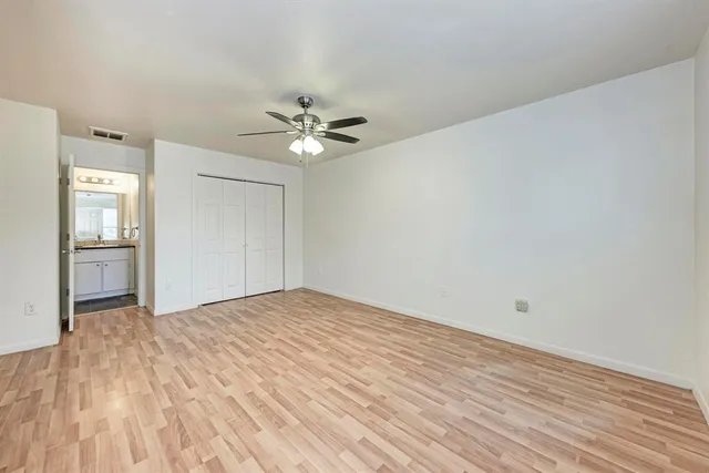 a view of an empty room with a bathroom