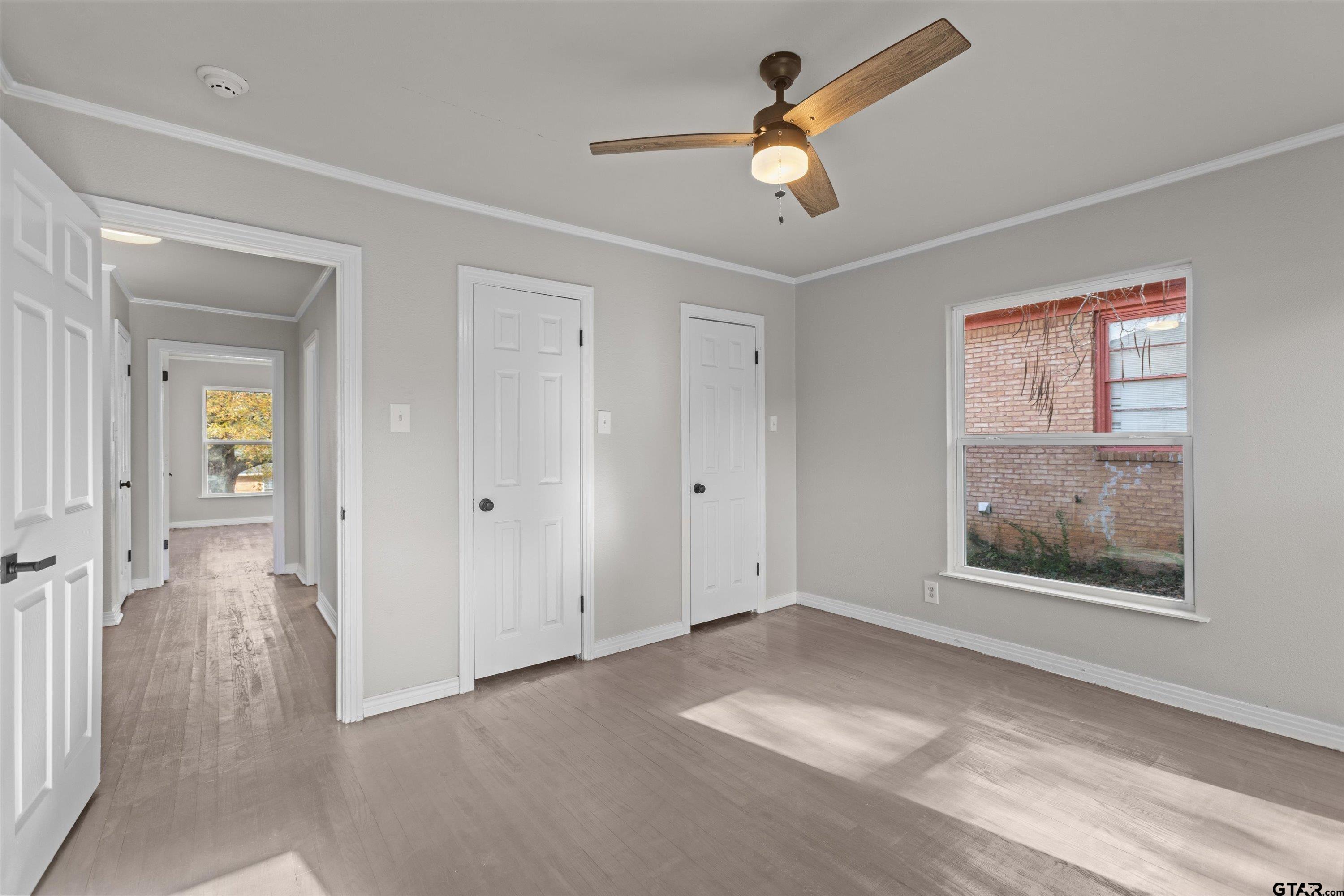 1330 Graham Drive Tyler, TX 75701 - Photo 15 of 22 wooden floor in an empty room with a window