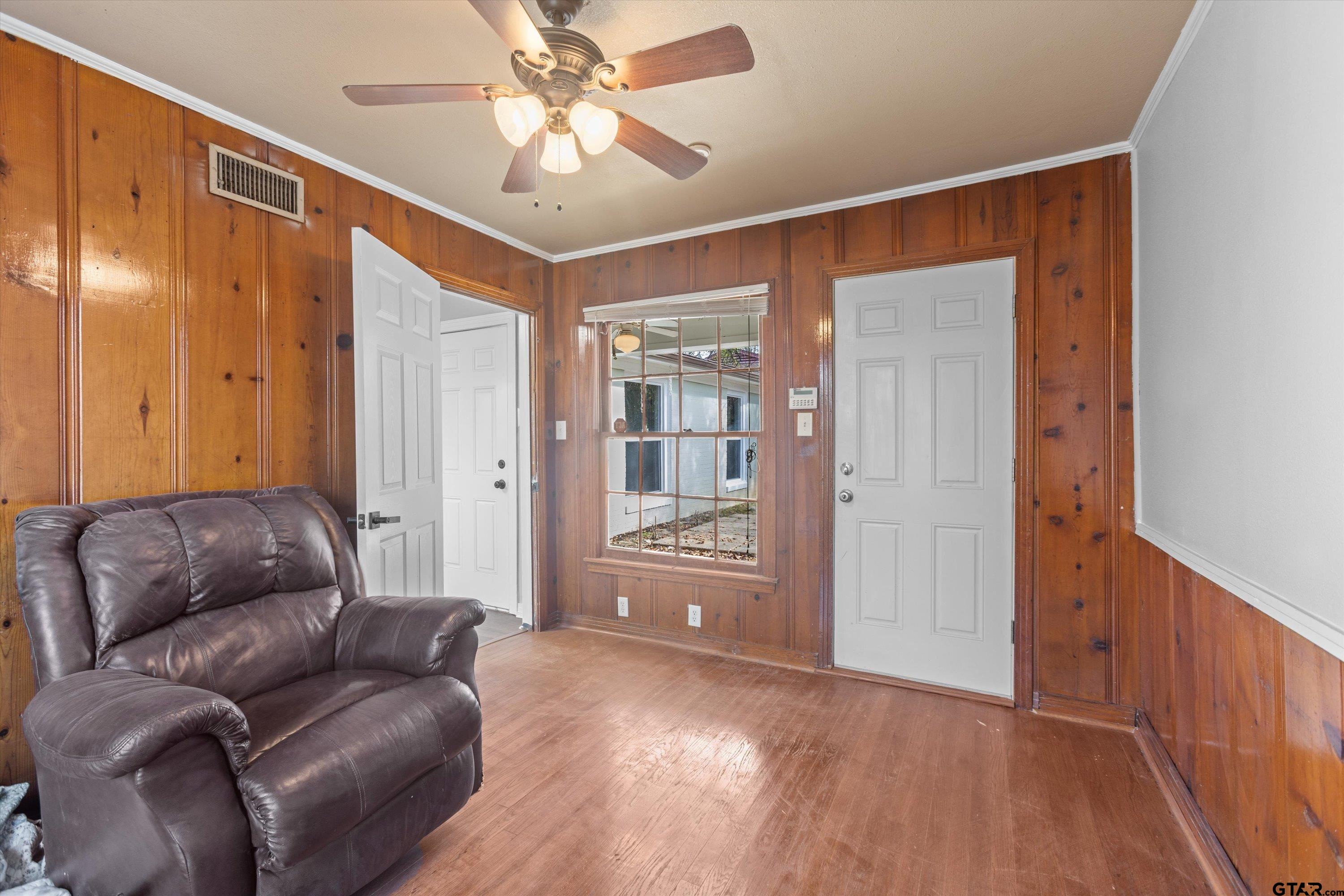 1330 Graham Drive Tyler, TX 75701 - Photo 17 of 22 a living room with furniture and a chandelier