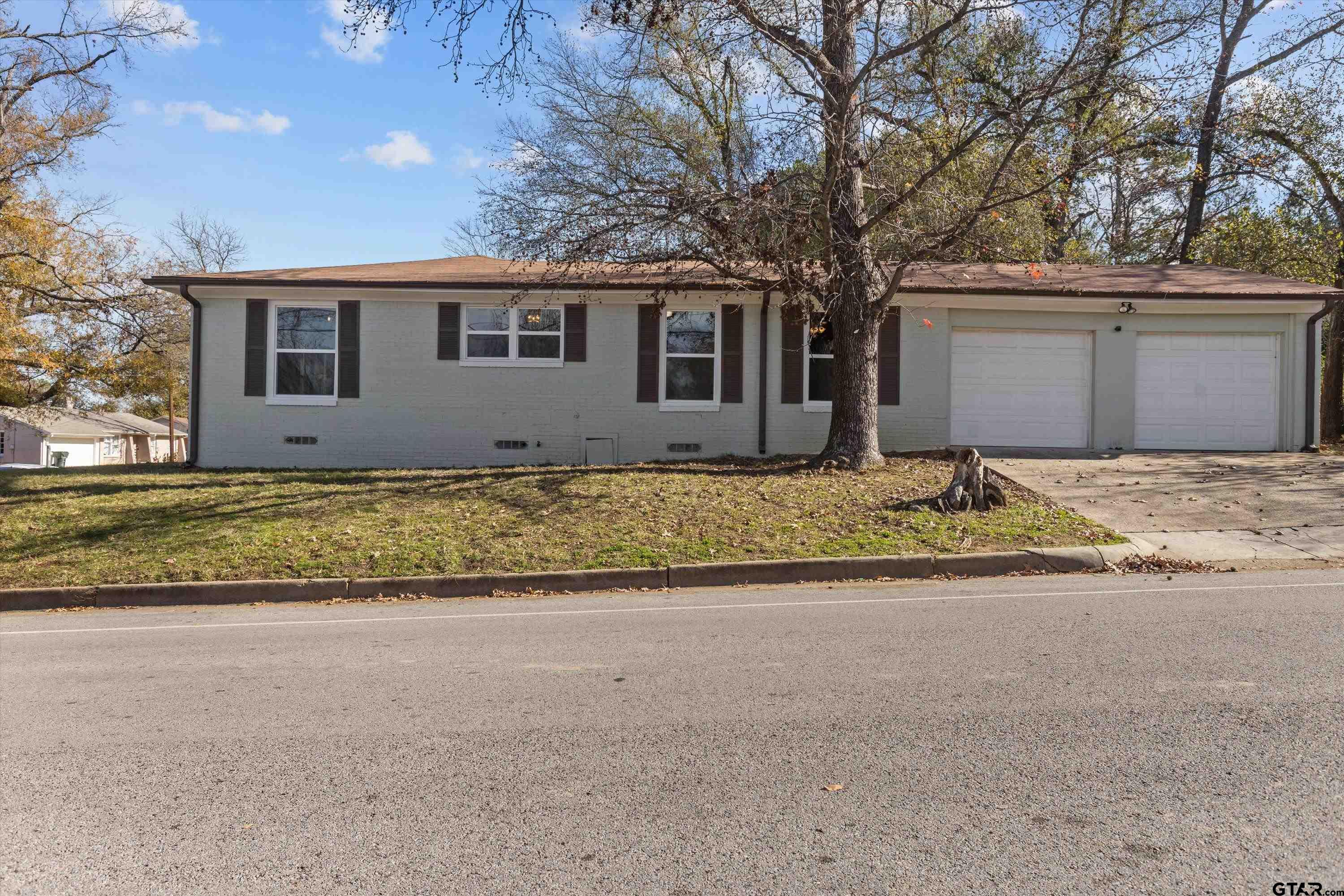 1330 Graham Drive Tyler, TX 75701 - Photo 2 of 22 a front view of a house with a yard